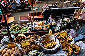 Thailand, Locals sell fruits, food and products at Damnoen Saduak floating market near Bangkok 